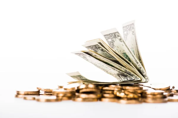 Close-up view of dollar banknotes and shiny golden coins isolated on white — Stock Photo