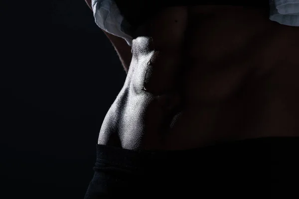 Close up cropped view of sweaty muscular abs of sportswoman, isolated on grey — Stock Photo