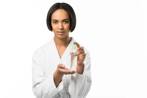 African american beauty holding big perfume bottle,  isolated on white — Stock Photo