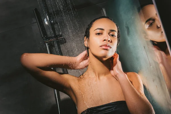 Beautiful african american girl taking shower — Stock Photo