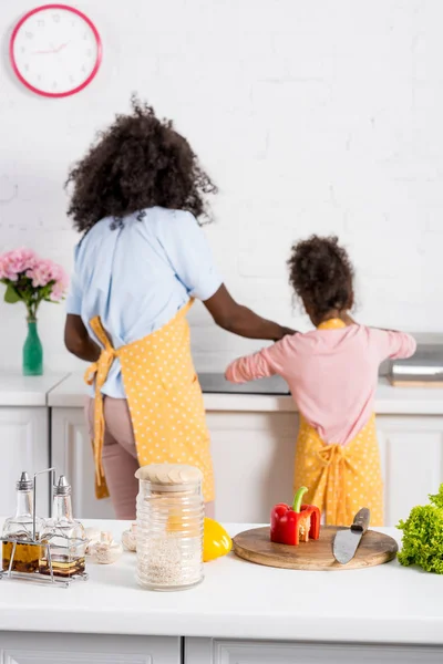 Selective focus of african american family cooking on kitchen — Stock Photo