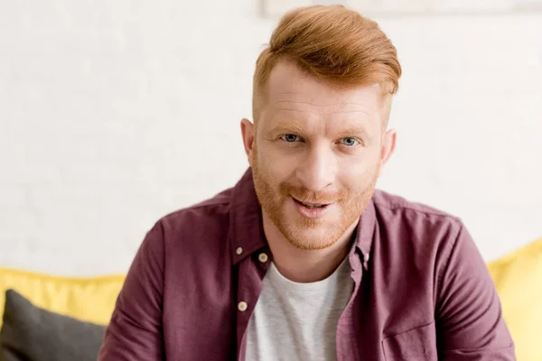 Portrait of handsome young redhead man smiling at camera — Stock Photo