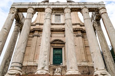 low angle view of historical building with columns in rome clipart