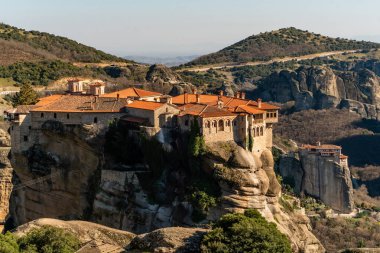 monastery of holy trinity on rock formations in meteora  clipart