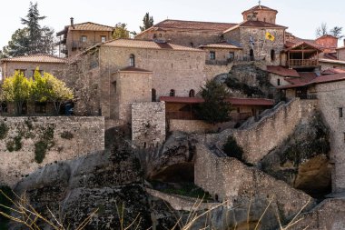 trees and plants near ancient monastery in meteora  clipart