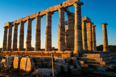 sunlight on ancient columns of parthenon in athens  clipart