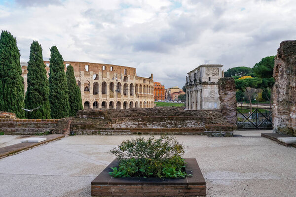 ancient colosseum near historical buildings in rome