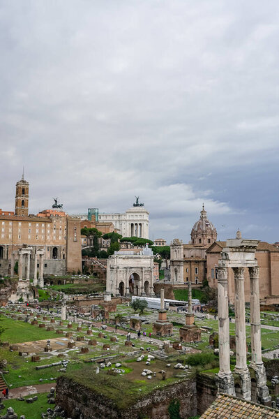 historical landmarks of rome against sky with clouds 