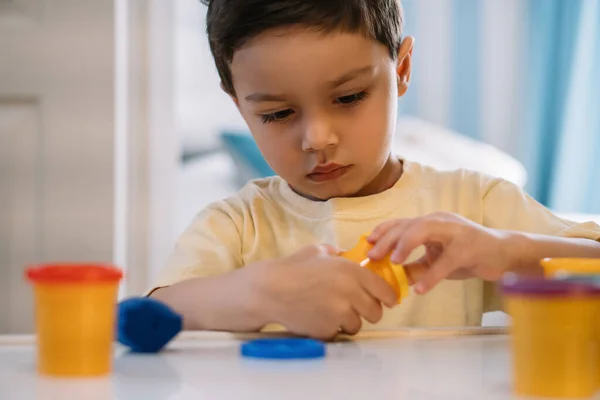 Selective Focus Attentive Adorable Boy Opening Container Plasticine — Stock Photo, Image