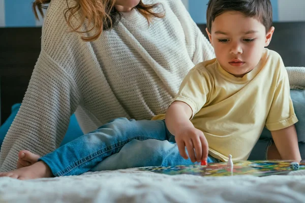 Cropped View Woman Adorable Son Playing Board Game Bed — Stock Photo, Image