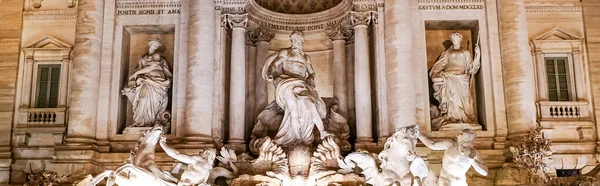 Panoramic concept of trevi fountain with ancient sculptures in rome — Stock Photo