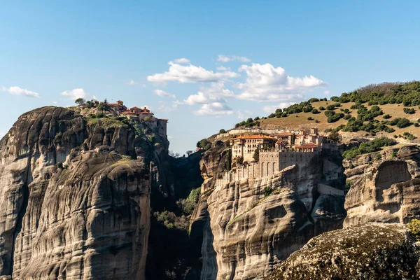 Orthodox monasteries on rock formations near mountains in meteora — Stock Photo