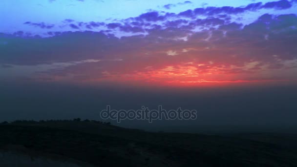 Desert hill tops with vibrant colored sunset — Stock Video