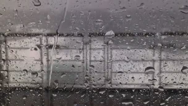 Rain on the window in a roaring 40s storm — Stock Video