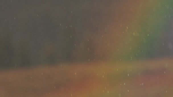 Arco iris a través de la lluvia cámara lenta — Vídeo de stock