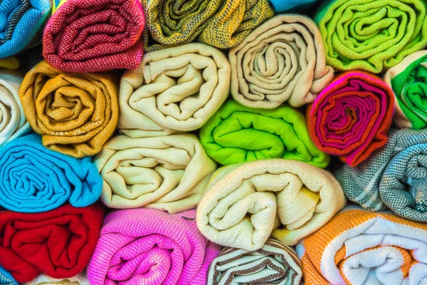 Roll shaped stacked Traditional colorful silk ,cashmere head scarves or shawls — Stock Photo, Image