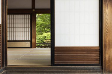Traditional japanese room with tatami, shoji and garden clipart