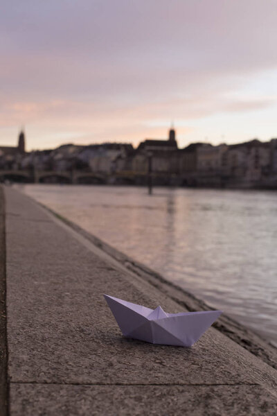 Small delicate white paper ship