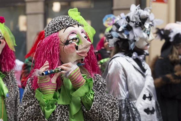 Basel carnival 2016 in Switzerland. Single participant playing piccolo — Stock Photo, Image