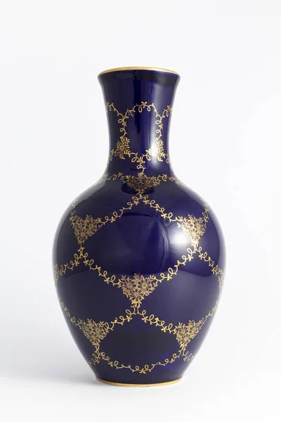 Beautiful cobalt blue colored vintage porcelain vase with gold o — Stock Photo, Image