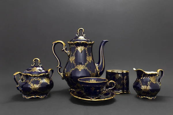 Beautiful cobalt blue colored vintage porcelain tea set with gol — Stock Photo, Image