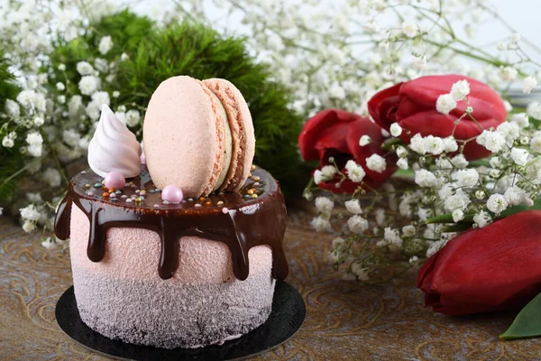 Fresh luxury chocolate dripping cake , macaroon on top dessert. Catering Dining Eating Party Sharing Concept. Mother's Day, Valentine Day, Woman's Day, Happy Birthday. Appetizing tasty, fun, colorful