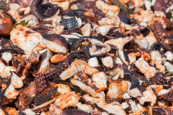 Octopus small chopped bites, street food festival. Seafood festival. Live cooking session contest. Fresh Food Buffet Brunch Catering Dining Eating Party Sharing Concept. Finely chopped octopus tentacl