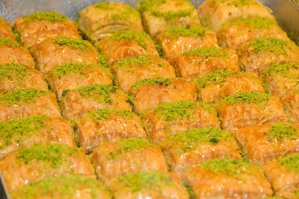 Traditional baklava sweet dessert delights, cataif pastry during hotel brunch buffet outside outdoor in the garden by the pool. Fresh Food Buffet Brunch Catering Dining Eating Party Sharing Concept