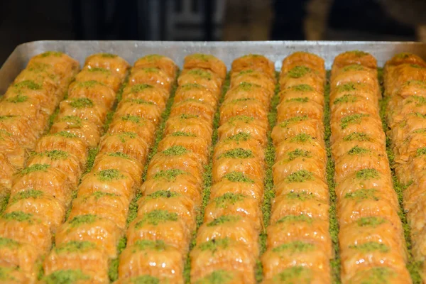 Traditional baklava sweet dessert delights, cataif pastry during hotel brunch buffet outside outdoor in the garden by the pool. Fresh Food Buffet Brunch Catering Dining Eating Party Sharing Concept