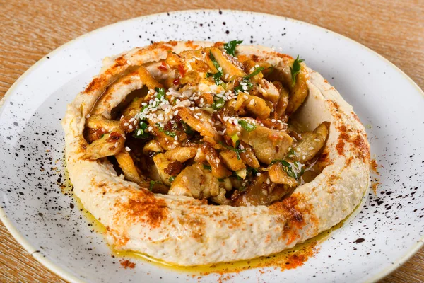 Hummus is a dip, spread, or savory dish made from cooked, mashed chickpeas blended with tahini, lemon juice, and garlic. It is popular in the Middle East and Mediterranean, as well as in Middle East