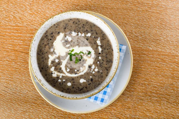 Mushroom cream soup. Chanterelle cream soup on wooden background, selective focus — Stock Image Mushroom Cream Soup Chanterelle Cream Soup Wooden Background Selective Focus Stock Photo
