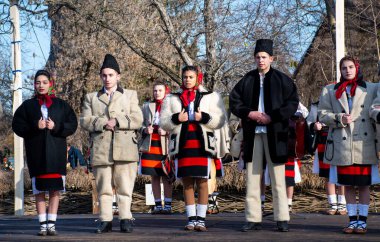 Bucharest, Romania, 25th of December 2019: Christmas tradition festival in Balkans, Romanian dancers and actors in traditional and gypsy clothes clipart