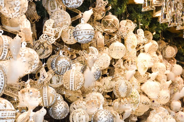 Christmas decorations on the market in Vienna. For sale on Christmas fair in Western Europe, Vienna, Austria. Golden balls, bulbs, bubbles, decorations and ornaments, colored shiny magic fairy tale