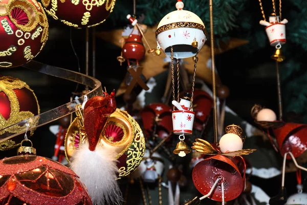 Christmas decorations on the market in Vienna. For sale on Christmas fair in Western Europe, Vienna, Austria. Golden balls, bulbs, bubbles, decorations and ornaments, colored shiny magic fairy tale