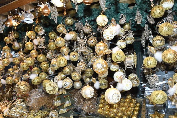 Christmas decorations on the market in Vienna. For sale on Christmas fair in Western Europe, Vienna, Austria. Golden balls, bulbs, bubbles, decorations and ornaments, colored shiny magic fairy tale