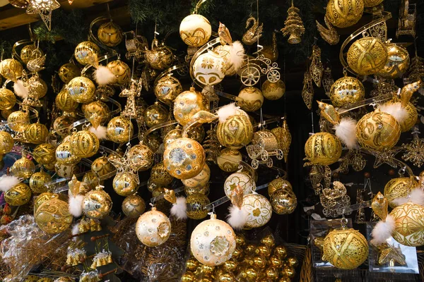 Christmas decorations on the market in Vienna. For sale on Christmas fair in Western Europe, Vienna, Austria. Golden balls, bulbs, bubbles, decorations and ornaments, colored shiny magic fairy tale