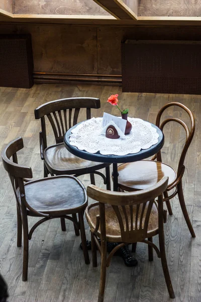 Table with chairs in an old cafe — Stock Photo, Image