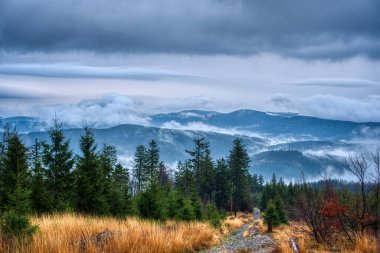 Beautiful view of clouds traveling over mountains in Beskydy, Czech