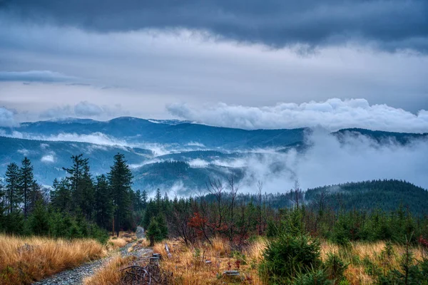 Beautiful view of clouds traveling over mountains in Beskydy, Czech