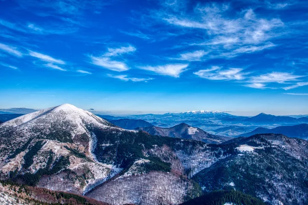 Mountain under snow cover with High Tatras in the background , slovakia Εικόνα Αρχείου