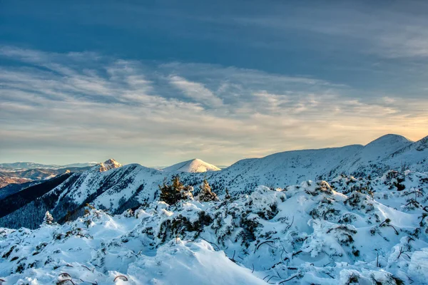 Winter mountain landscape at a sunny day with fog in the valleys. The Mala Fatra national park in Slovakia, Europe. — ストック写真