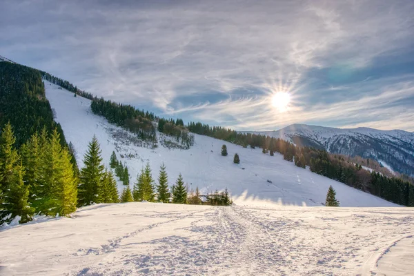 Sun over winter mountains, covered with snow , slovakia europe