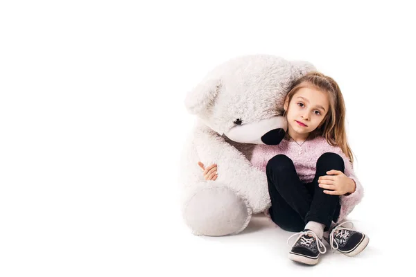 Little girl and a big white teddy bear. Isolated on white background. — Stock Photo, Image