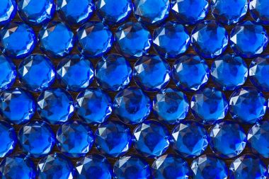 Precious sparkling rhinestones blue colors on a dark background clipart