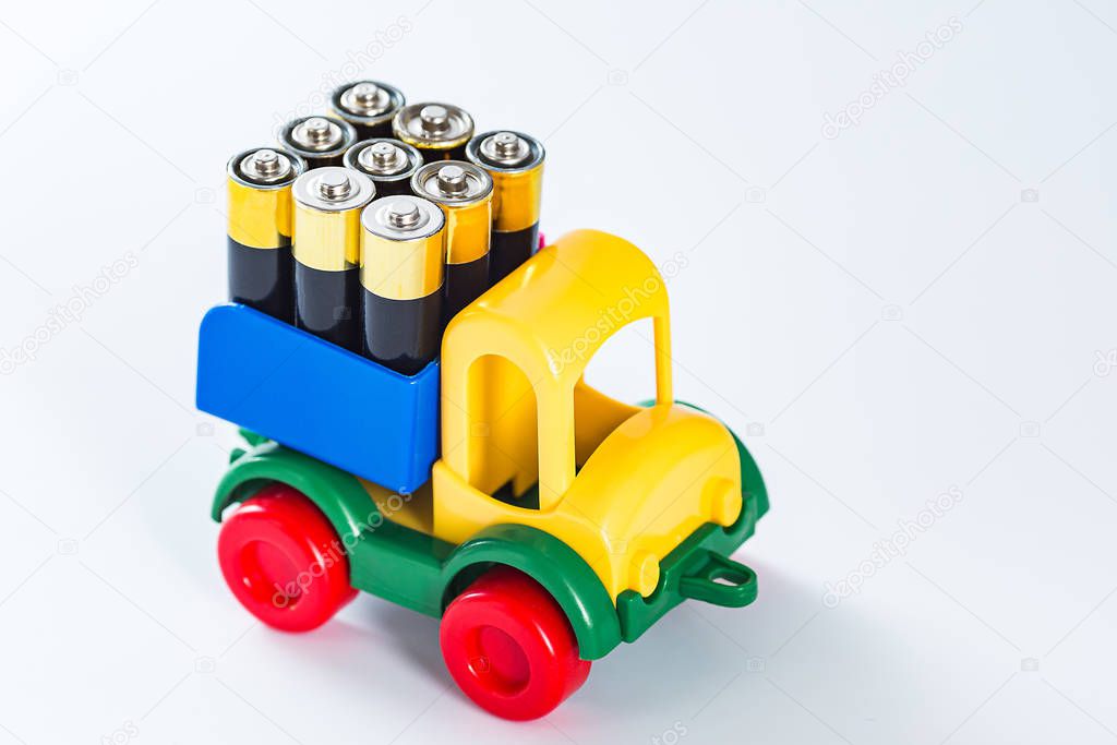 Toy truck with full body of AA batteries. energy need concept. electric truck.