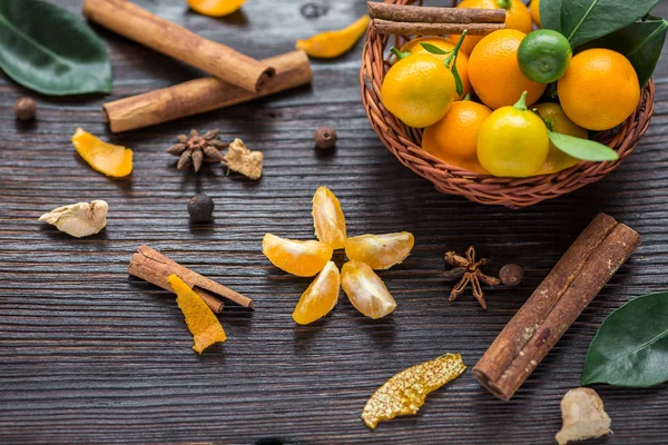 Still Life Calamondines Basket Cinnamon Sticks Anise Star Cardamom Ginger — Stock Photo, Image