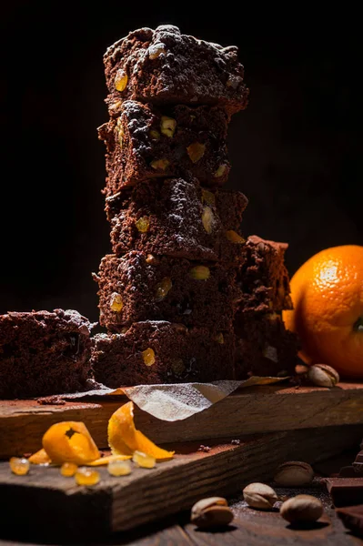 Stack Chocolate Brownies Wooden Background Orange Peels Pistachio Nuts Homemade — Stock Photo, Image