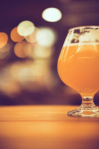 chill craft beer on dark background and light bokeh