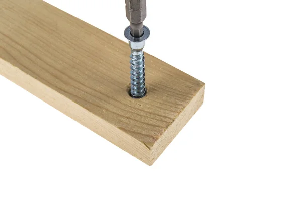 The screw is screwed into the board — Stock Photo, Image