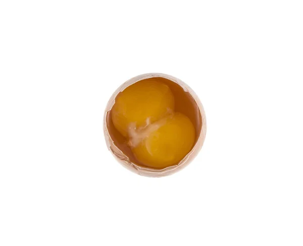 Яйце і два жовтки на ізольованому білому тлі — стокове фото